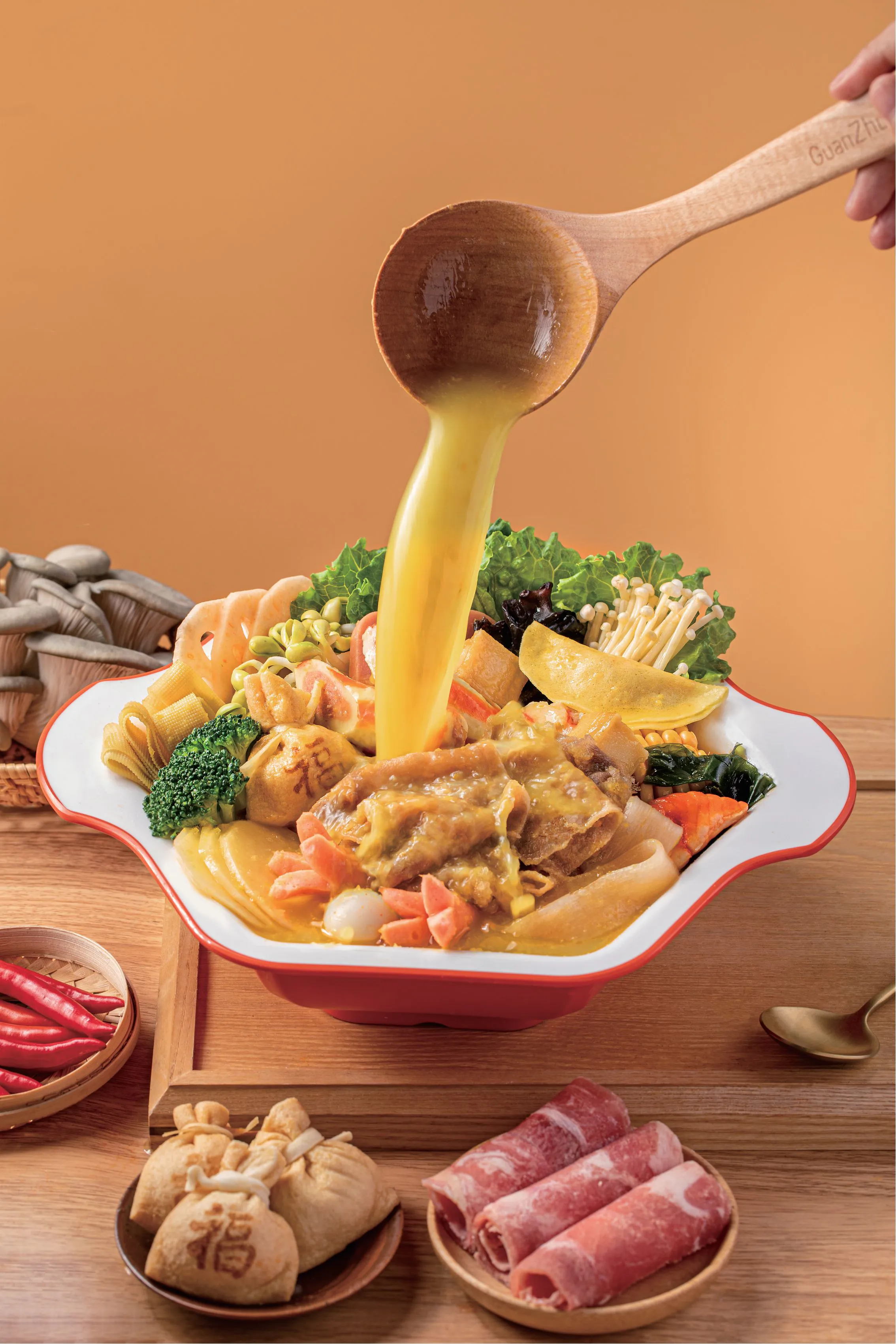 Golden broth hot pot with assorted ingredients at Spice House, a Chinese Restaurant in Plano